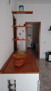 a kitchen with a wooden counter top in a room at Mini appartamento da Cetty in Reggio di Calabria