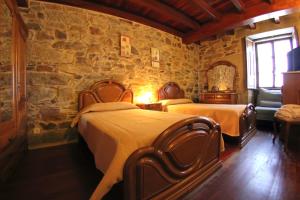 En eller flere senger på et rom på Casa Do Tarela