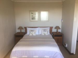 Postel nebo postele na pokoji v ubytování Everwood Estates