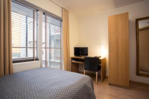 Postel nebo postele na pokoji v ubytování Hotel Frón