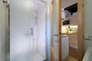 a shower with a glass door in a bathroom at San Clemente Holiday House in Bracciano +24 photos