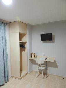 TV a/nebo společenská místnost v ubytování Hostal Can Massot