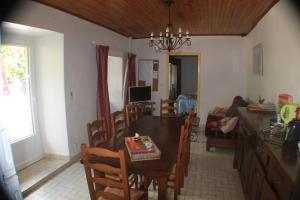 a kitchen and dining room with a table and chairs at les écureuils in Saint-Priest