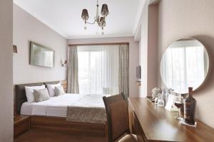 Ένα ή περισσότερα κρεβάτια σε δωμάτιο στο Hotel Pushkin