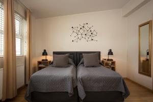 Postel nebo postele na pokoji v ubytování Hotel Frón