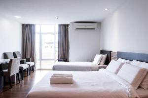 Postel nebo postele na pokoji v ubytování Classy Studio Apartment (KBCP)
