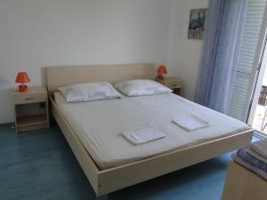 Postel nebo postele na pokoji v ubytování Radojka