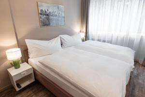 Postelja oz. postelje v sobi nastanitve Hotel Birsighof Basel City Center