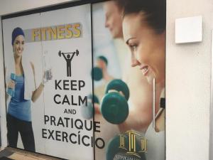 a sign that says fitness keep calm and parachute exercise at Atrium Confort Hotels in Parauapebas