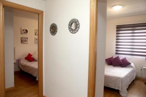 Posteľ alebo postele v izbe v ubytovaní Apartamento Castilla