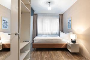 Postelja oz. postelje v sobi nastanitve Hotel Birsighof Basel City Center