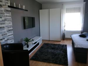Posteľ alebo postele v izbe v ubytovaní Csabai Apartman