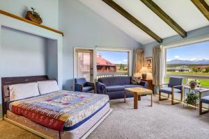 a bedroom with a bed and a living room at Aspenwood 4229-30 in Pagosa Springs