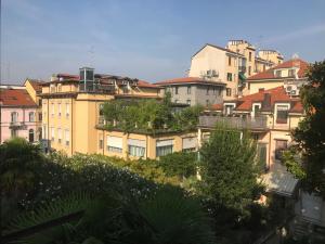 a group of buildings with trees on top of them at Appartamenti Aspromonte in Milan