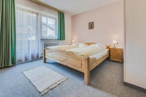 Postel nebo postele na pokoji v ubytování Haus Kristall