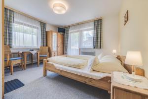 Postel nebo postele na pokoji v ubytování Haus Kristall
