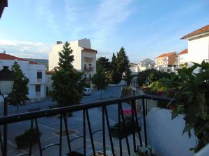 a balcony with a view of a street and buildings at Casa Do Prado in Macedo de Cavaleiros