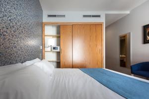 Posteľ alebo postele v izbe v ubytovaní Hotel AACR Museo