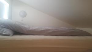 A bed or beds in a room at Vatnsás 10