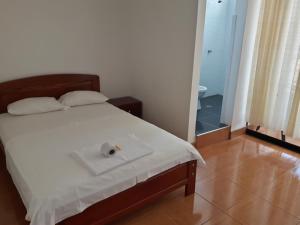 Postel nebo postele na pokoji v ubytování Hotel Santorini