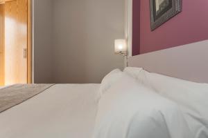 Posteľ alebo postele v izbe v ubytovaní Hotel AACR Museo