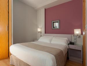 Posteľ alebo postele v izbe v ubytovaní Hotel AACR Museo