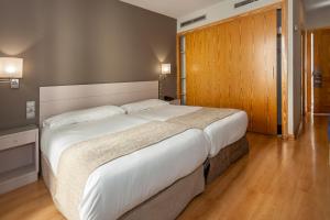 Posteľ alebo postele v izbe v ubytovaní Hotel AACR Museo
