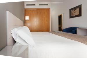 Posteľ alebo postele v izbe v ubytovaní Hotel AACR Museo