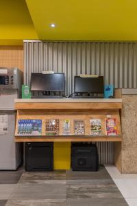a counter in a store with a cash register at Bouti City Capsule Inn in Taipei