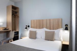 Postel nebo postele na pokoji v ubytování Hôtel Moulin Vert