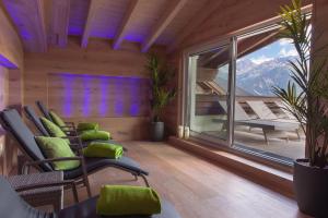a room with chairs and a balcony with a view at ... mein romantisches Hotel Toalstock in Fiss