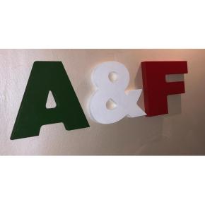 a sign with the letters a and f on a wall at A&F Apartment Padova centro storico in Padova