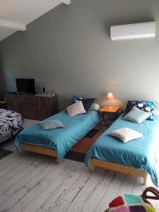 מיטה או מיטות בחדר ב-La Mancine Laulan