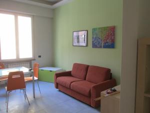 a living room with a couch and a table at Wendy's apartment in Salerno