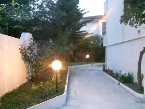 a walkway leading to a house at night at pienosole B&B in Francavilla al Mare