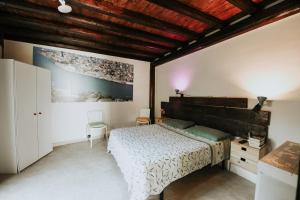 Tempat tidur dalam kamar di Antonella home