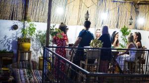 a group of people standing in a room at Boho 27 Hostel Marrakech in Marrakesh