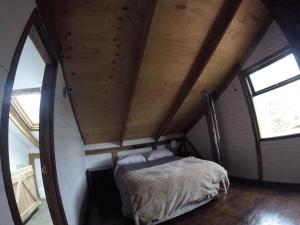Postel nebo postele na pokoji v ubytování Hostal Climb House