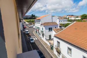 a view of a city street from a building at Arquinha Apartment in Ponta Delgada