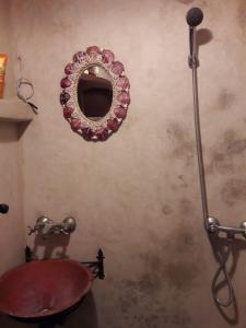a bathroom with a mirror on the wall at The Jewel of the Northern Moroccan Atlantic in Asilah in Asilah