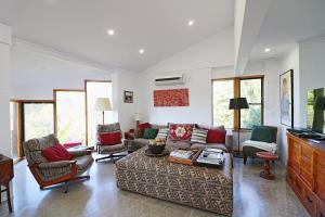 a living room with a couch and chairs at Seavista 2 in Pambula Beach