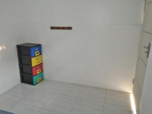 a corner of a room with a toy in the corner at Kost 48 Surabaya in Surabaya