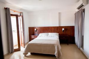 Postel nebo postele na pokoji v ubytování Hotel Acapulco