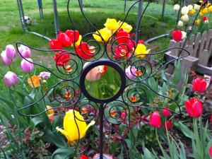a garden with a bunch of flowers in the grass at Grillinghof in Kirchberg in Tirol