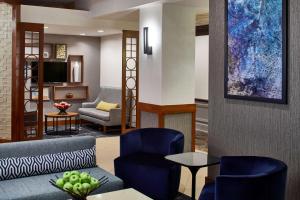 a living room filled with furniture and a tv at Hyatt Place Atlanta/Cobb Galleria in Atlanta