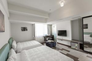 TV a/nebo společenská místnost v ubytování Tien Hsiang Lin Sea Dragon King Hotel