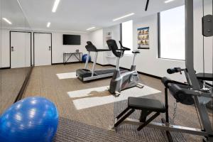 a fitness room with a gym with exercise equipment at Quest Penrith in Penrith