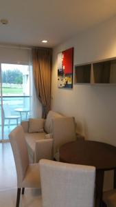 a living room with a couch and a table at GrandBlue Condominium 201 in Mae Pim