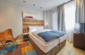 Ένα ή περισσότερα κρεβάτια σε δωμάτιο στο LALA home Chalet & Appartement