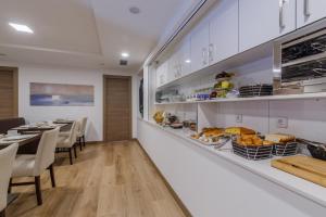 a kitchen filled with lots of counter space at Suite Home Sardinero in Santander
